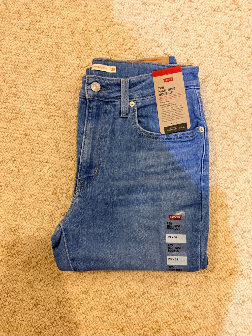 Levi's light blue high-rise bootcut jeans with tag